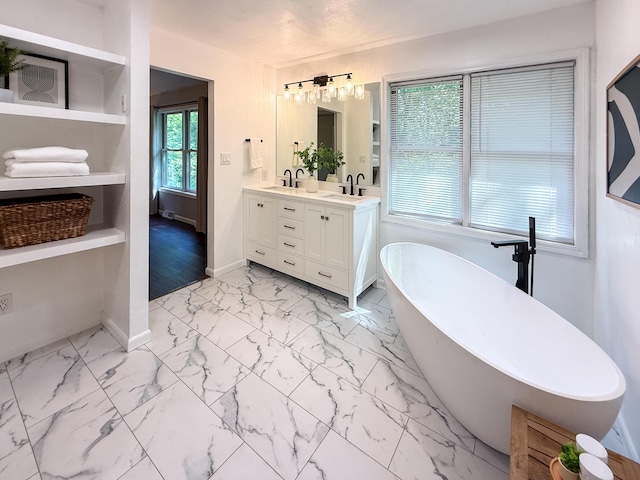 3712 Godfrey Dr, Columbia, MO 65203 - full bathroom with double vanity, a freestanding tub, and marble finish flooring