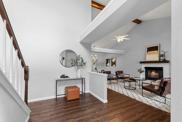3712 Godfrey Dr, Columbia, MO 65203 - living room featuring beam ceiling, wood finished floors, stairs, a fireplace, and ceiling fan