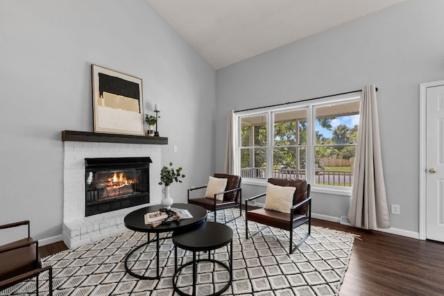 3712 Godfrey Dr, Columbia, MO 65203 - living area featuring wood finished floors, a fireplace, and high vaulted ceiling
