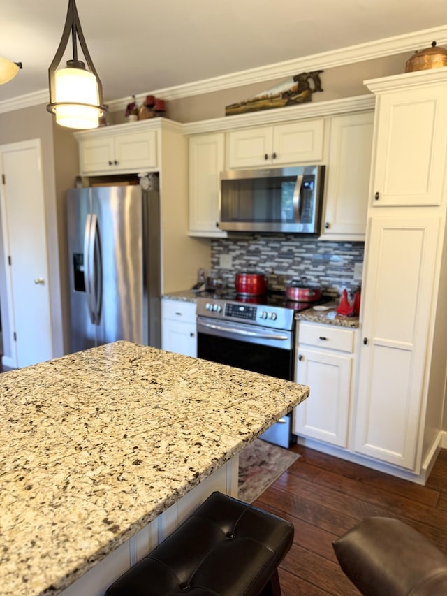 1620 S Berkley Dr, Columbia, MO 65201 - kitchen with appliances with stainless steel finishes, crown molding, light stone counters, and white cabinetry