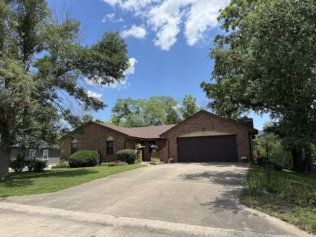 1620 S Berkley Dr, Columbia, MO 65201 - ranch-style home with brick siding, an attached garage, driveway, and a front lawn