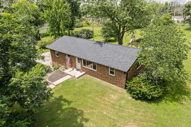 661 N W Park Ln, Columbia, MO 65201 - view of front facade with brick siding, roof with shingles, and a front lawn