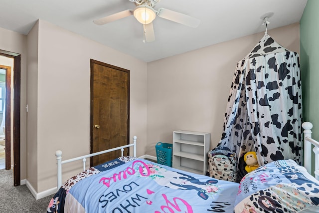 661 N W Park Ln, Columbia, MO 65201 - carpeted bedroom featuring baseboards and ceiling fan