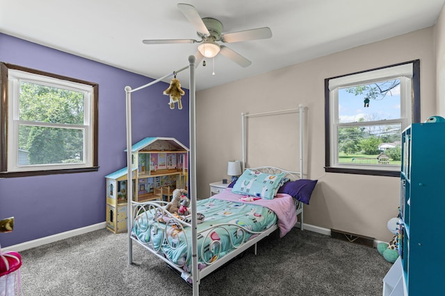 661 N W Park Ln, Columbia, MO 65201 - carpeted bedroom featuring a ceiling fan and baseboards