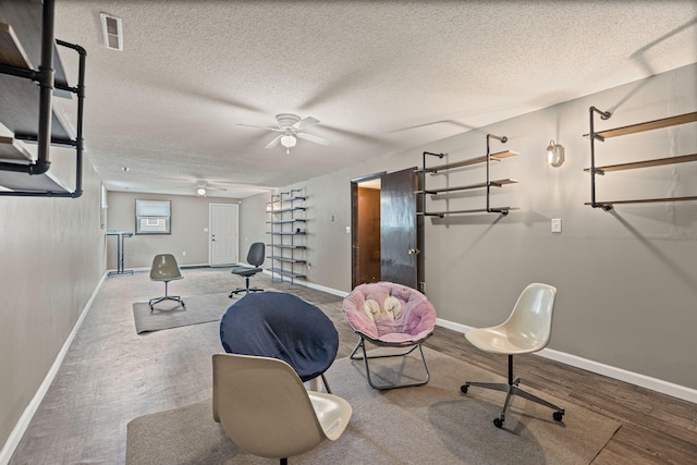 661 N W Park Ln, Columbia, MO 65201 - exercise room with ceiling fan, a textured ceiling, and wood finished floors