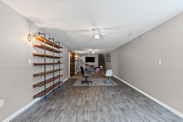 661 N W Park Ln, Columbia, MO 65201 - exercise area featuring a ceiling fan, wood finished floors, and a fireplace