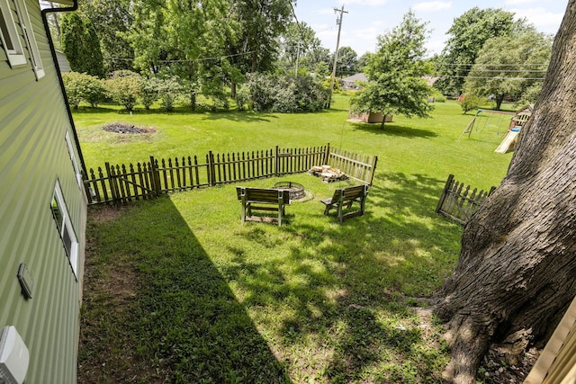 661 N W Park Ln, Columbia, MO 65201 - fenced backyard with an outdoor fire pit