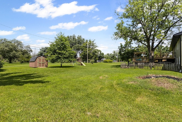 661 N W Park Ln, Columbia, MO 65201 - view of grassy yard with a storage shed and a playground