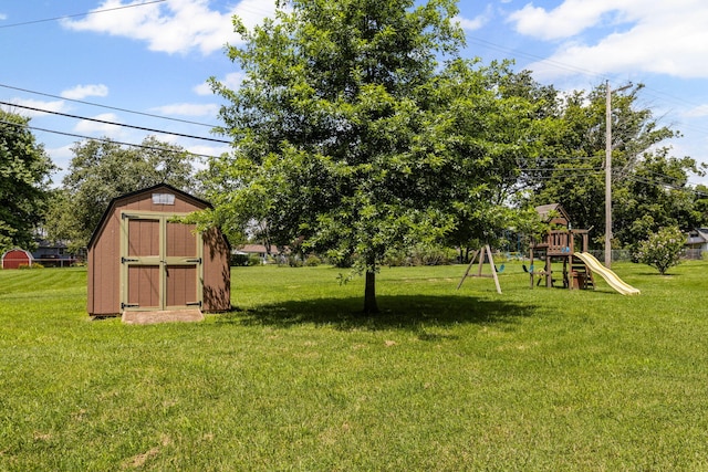 661 N W Park Ln, Columbia, MO 65201 - view of grassy yard with a shed and a playground