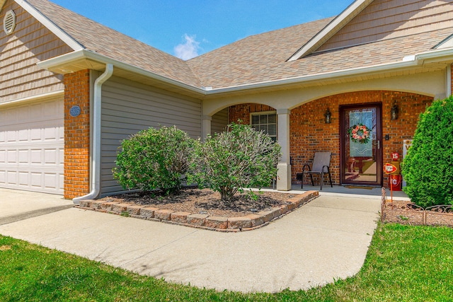5805 Vero Way, Columbia, MO 65201 - doorway to property featuring brick siding, covered porch, and roof with shingles