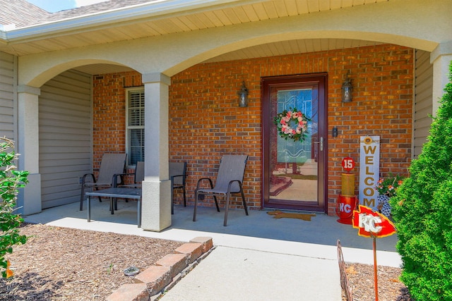 5805 Vero Way, Columbia, MO 65201 - view of exterior entry with brick siding and a porch