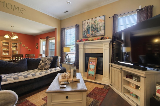 5805 Vero Way, Columbia, MO 65201 - living room featuring a chandelier, light wood finished floors, crown molding, and a tile fireplace