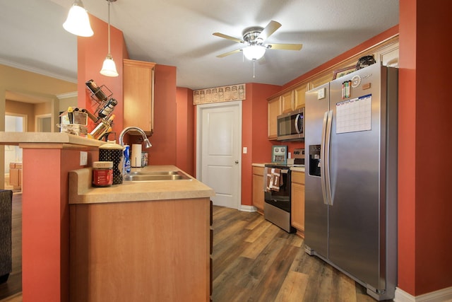 5805 Vero Way, Columbia, MO 65201 - kitchen featuring appliances with stainless steel finishes, a ceiling fan, dark wood-style floors, light countertops, and a peninsula