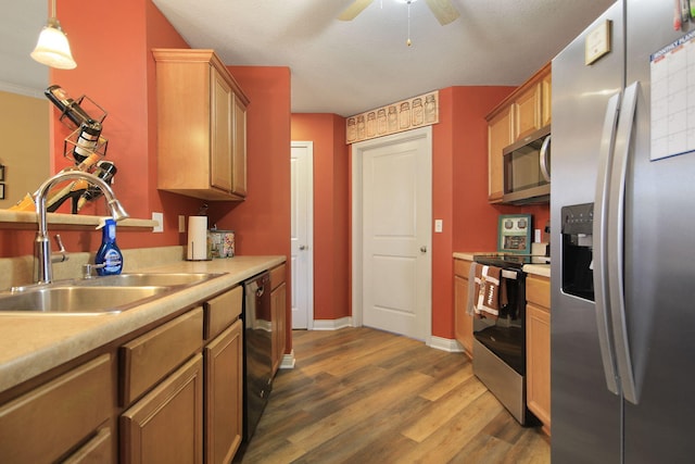 5805 Vero Way, Columbia, MO 65201 - kitchen featuring stainless steel appliances, light countertops, dark wood-type flooring, ceiling fan, and decorative light fixtures