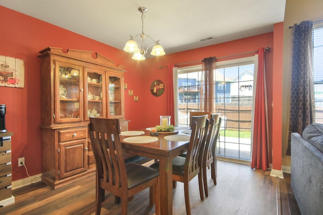 5805 Vero Way, Columbia, MO 65201 - dining space featuring wood finished floors, a chandelier, and healthy amount of natural light
