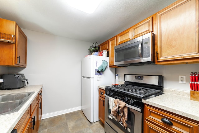 1601 Parklawn Ct, Columbia, MO 65202 - kitchen with stainless steel appliances and brown cabinets
