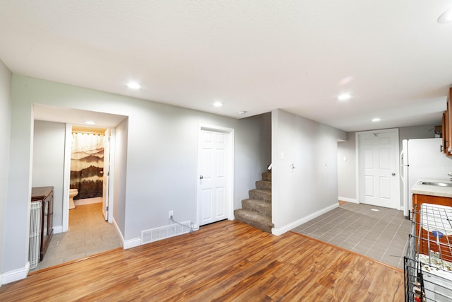 1601 Parklawn Ct, Columbia, MO 65202 - unfurnished living room featuring light wood-style flooring, stairs, and recessed lighting