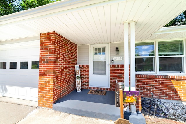 1601 Parklawn Ct, Columbia, MO 65202 - entrance to property featuring brick siding, an attached garage, and a porch