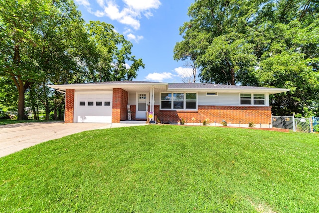 1601 Parklawn Ct, Columbia, MO 65202 - view of front facade with brick siding, a garage, and concrete driveway