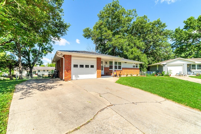 1601 Parklawn Ct, Columbia, MO 65202 - ranch-style house featuring brick siding, a garage, a front yard, and concrete driveway