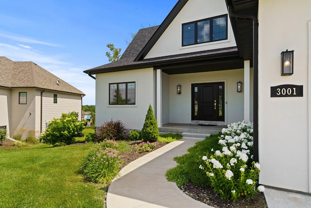 3001 Rivington Dr, Columbia, MO 65203 - property entrance featuring stucco siding, a yard, and a shingled roof