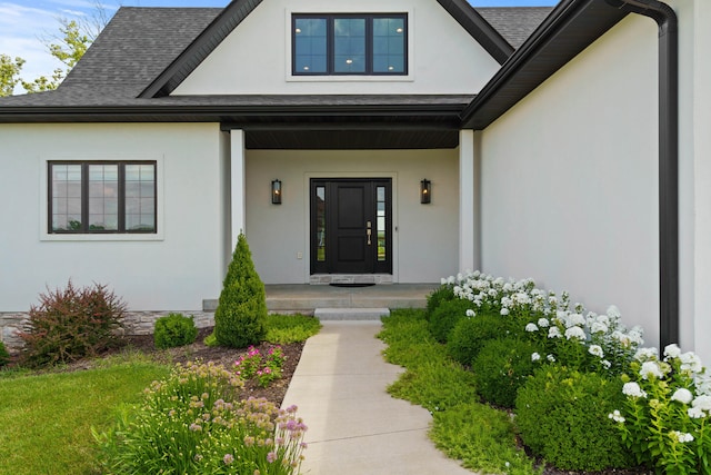 3001 Rivington Dr, Columbia, MO 65203 - doorway to property featuring stucco siding, covered porch, and a shingled roof