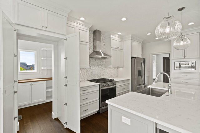 3001 Rivington Dr, Columbia, MO 65203 - kitchen featuring stainless steel appliances, wall chimney range hood, decorative backsplash, dark wood-type flooring, and white cabinetry