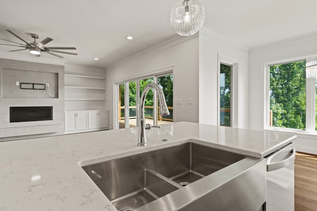 3001 Rivington Dr, Columbia, MO 65203 - kitchen with crown molding, healthy amount of natural light, dishwasher, light stone countertops, and recessed lighting