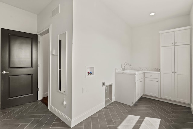 3001 Rivington Dr, Columbia, MO 65203 - laundry area featuring hookup for a washing machine, electric dryer hookup, cabinet space, and recessed lighting