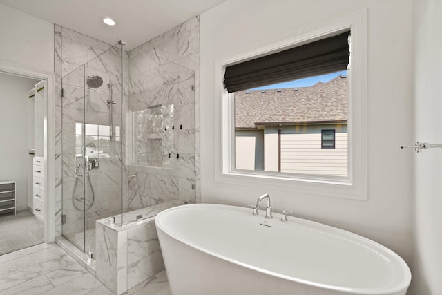 3001 Rivington Dr, Columbia, MO 65203 - full bath with marble look tile flooring, a freestanding tub, a marble finish shower, and recessed lighting