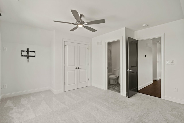 3001 Rivington Dr, Columbia, MO 65203 - unfurnished bedroom with carpet floors, connected bathroom, ceiling fan, and a closet