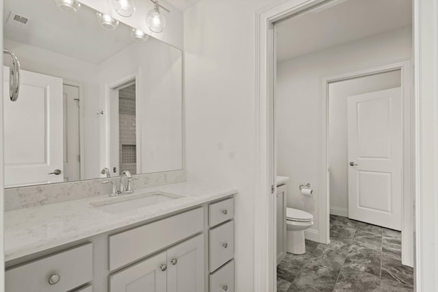 3001 Rivington Dr, Columbia, MO 65203 - bathroom featuring vanity and marble look tiles