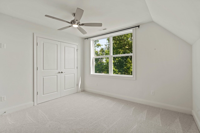 3001 Rivington Dr, Columbia, MO 65203 - unfurnished bedroom featuring light colored carpet, lofted ceiling, a closet, and ceiling fan