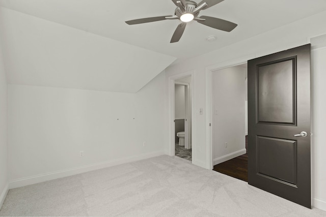 3001 Rivington Dr, Columbia, MO 65203 - unfurnished bedroom with carpet floors, vaulted ceiling, ensuite bath, and ceiling fan