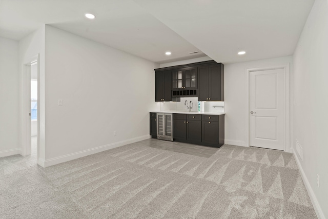 3001 Rivington Dr, Columbia, MO 65203 - indoor wet bar featuring light carpet, recessed lighting, and wine cooler