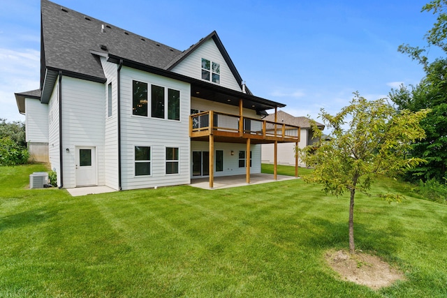 3001 Rivington Dr, Columbia, MO 65203 - back of property featuring a patio area, roof with shingles, a yard, and a deck