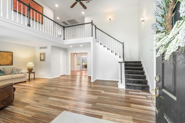 10550 E David Allen Rd, Columbia, MO 65201 - foyer with ceiling fan, stairs, wood finished floors, a towering ceiling, and recessed lighting