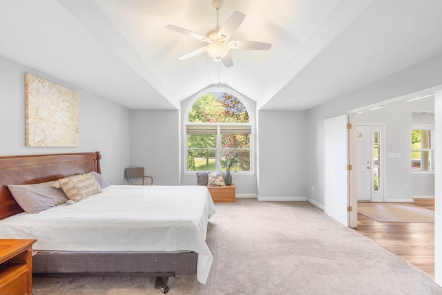10550 E David Allen Rd, Columbia, MO 65201 - bedroom with multiple windows, a ceiling fan, vaulted ceiling, and light colored carpet