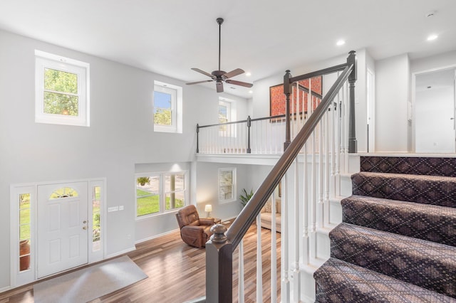 10550 E David Allen Rd, Columbia, MO 65201 - entrance foyer with wood finished floors, stairway, ceiling fan, recessed lighting, and a high ceiling
