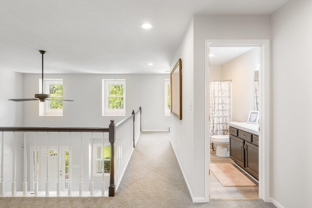 10550 E David Allen Rd, Columbia, MO 65201 - hall with light colored carpet, recessed lighting, and an upstairs landing