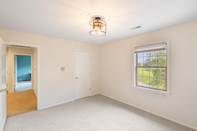 10550 E David Allen Rd, Columbia, MO 65201 - spare room featuring light colored carpet and baseboards