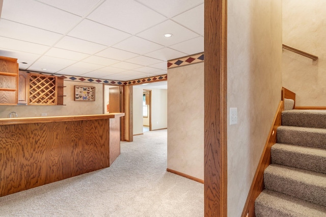 10550 E David Allen Rd, Columbia, MO 65201 - indoor wet bar with stairs, light colored carpet, a drop ceiling, and recessed lighting