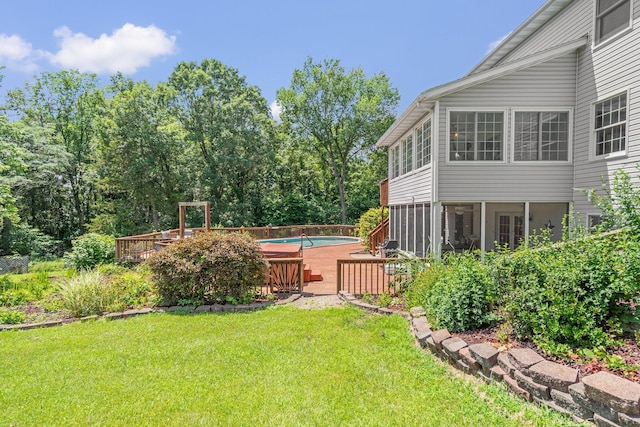 10550 E David Allen Rd, Columbia, MO 65201 - view of green lawn with a wooden deck and an outdoor pool