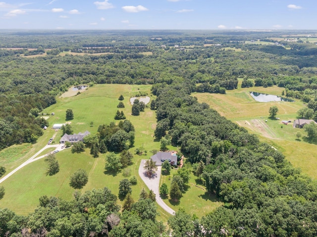 10550 E David Allen Rd, Columbia, MO 65201 - drone / aerial view of a nearby body of water and a heavily wooded area