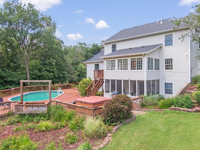 10550 E David Allen Rd, Columbia, MO 65201 - rear view of property with a wooden deck, stairs, an outdoor pool, a yard, and a sunroom
