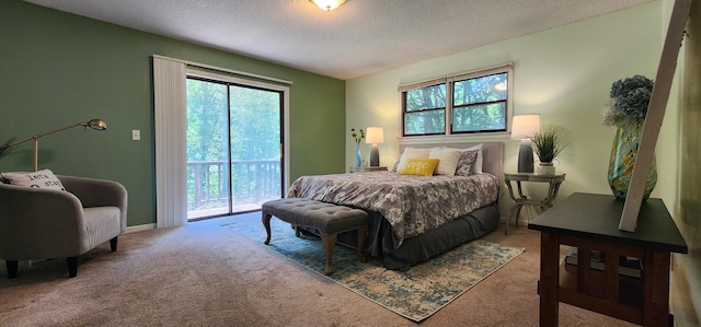 2716 Shagbark Cir, Jefferson City, MO 65109 - carpeted bedroom featuring access to exterior, multiple windows, and a textured ceiling