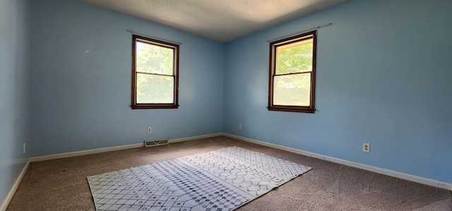 2716 Shagbark Cir, Jefferson City, MO 65109 - carpeted empty room featuring a textured ceiling and baseboards
