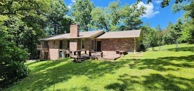2716 Shagbark Cir, Jefferson City, MO 65109 - back of house featuring brick siding, a chimney, and a wooden deck