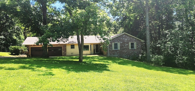 2716 Shagbark Cir, Jefferson City, MO 65109 - view of front of house with an attached garage, brick siding, and a front lawn
