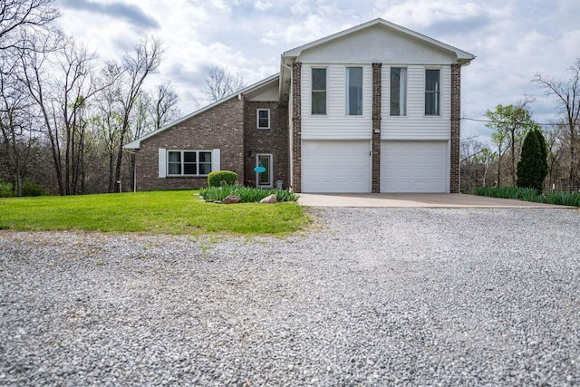 2130 E 163, Columbia, MO 65201 - view of front facade with brick siding, gravel driveway, an attached garage, and a front yard